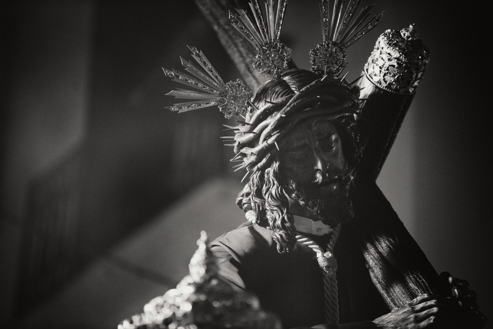 Black and white photo of a religious sculpture of Christ, symbolizing faith and devotion.