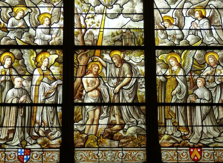 Detailed stained glass artwork illustrates biblical scenes in a church setting.