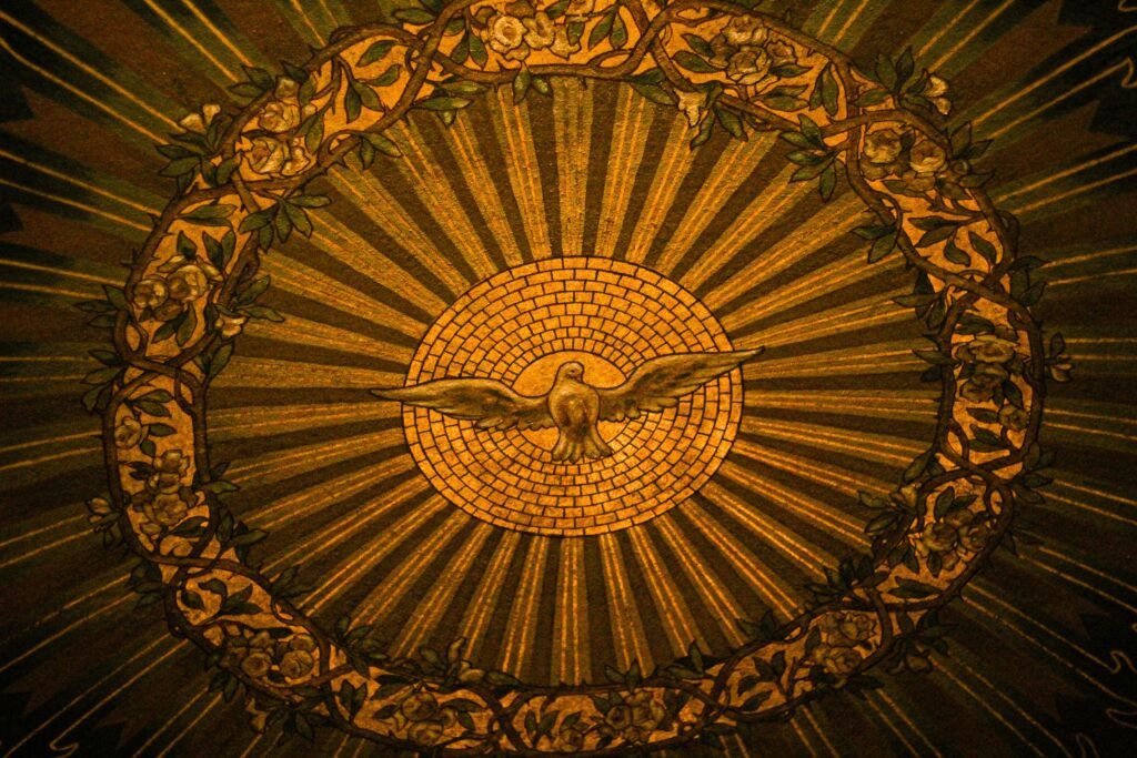 Close-up of intricate stained glass depicting the Holy Spirit in a Buffalo, NY church.