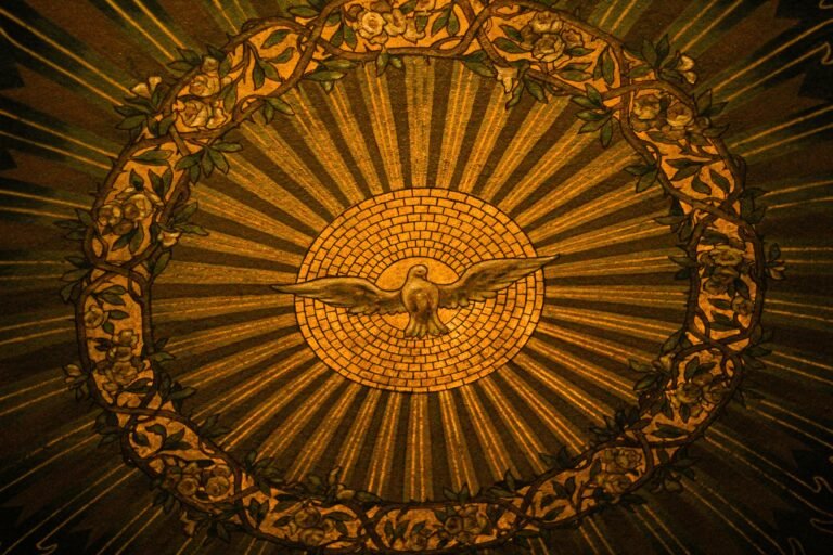 Close-up of intricate stained glass depicting the Holy Spirit in a Buffalo, NY church.