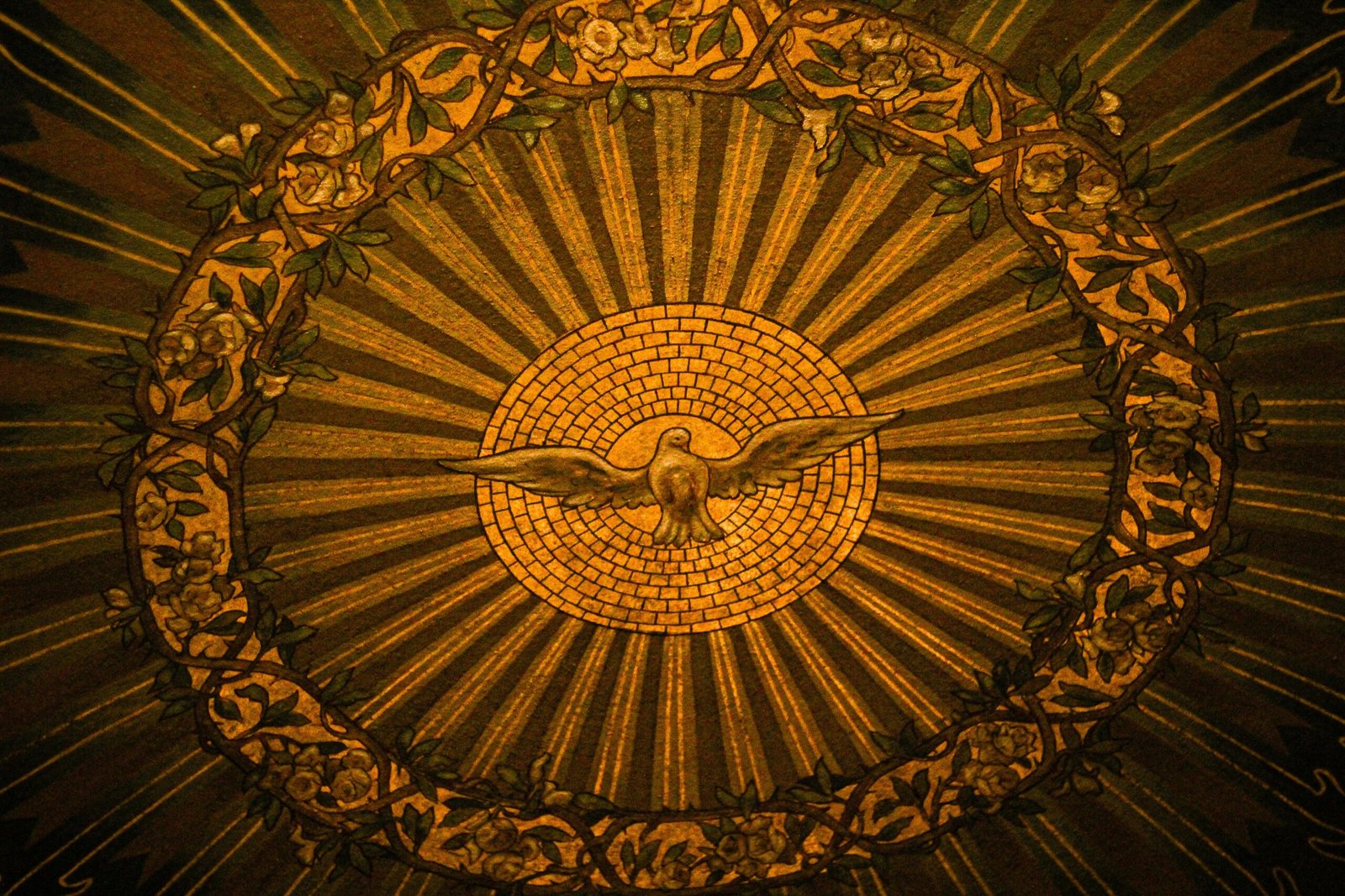Close-up of intricate stained glass depicting the Holy Spirit in a Buffalo, NY church.