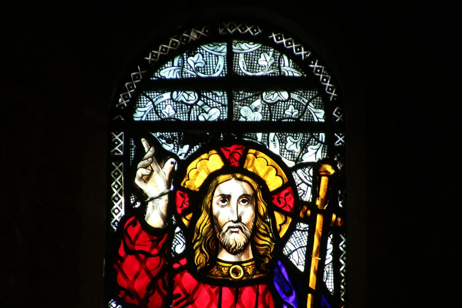 Vibrant stained glass depiction of Jesus Christ in Knysna, South Africa church.