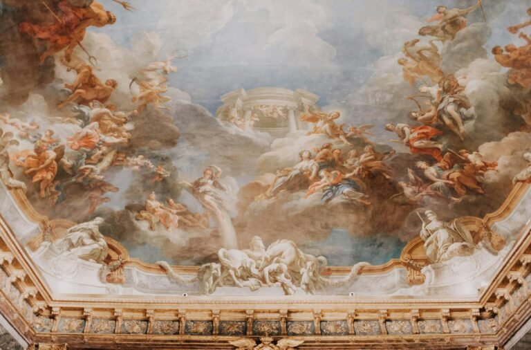 Intricate Baroque ceiling mural with classical art figures, creating a divine scene.